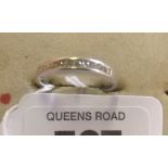 AN 11 STONE DIAMOND RING SET IN 9ct WHITE GOLD