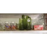 SHELF OF VARIOUS DRINKING GLASSES, DECANTERS & A GREEN GLASS WATER JUG SET