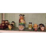 SHELF OF VARIOUS CHARACTER JUGS