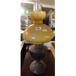 A BRASS OIL LAMP WITH GLASS SHADE & CHIMNEY