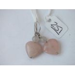A pair of rose quartz heart earrings