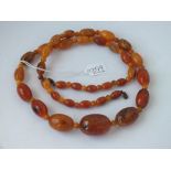 A amber coloured bead necklace