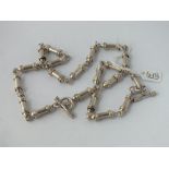 A fancy link heavy silver necklace & bracelet - 77gms