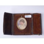An Edwardian miniature of a young boy, signed & boxed