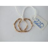 A pair of hoop earrings in 9ct