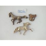 Three silver horse charms