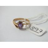 A amethyst & diamond crossover ring set in 9ct - size O - 1.8gms
