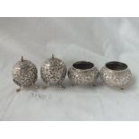 Indian four-piece cruet with chased decoration