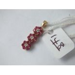 A ruby & diamond triple cluster pendant