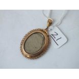 A large oval double sided glass locket in 9ct