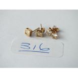 Two pairs of stone set ear studs in 9ct