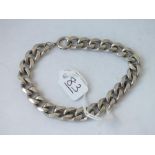A heavy silver curb link bracelet