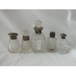 Five various silver topped bottles