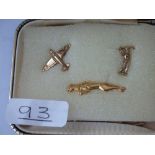 Three men's lapel pins in 9ct - (Plane, Golfer, Jaguar)