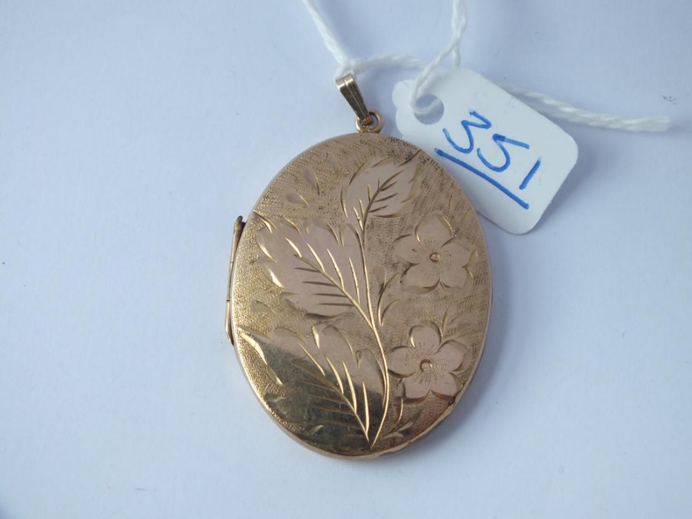 A large oval back & front locket in 9ct - 12.5gms