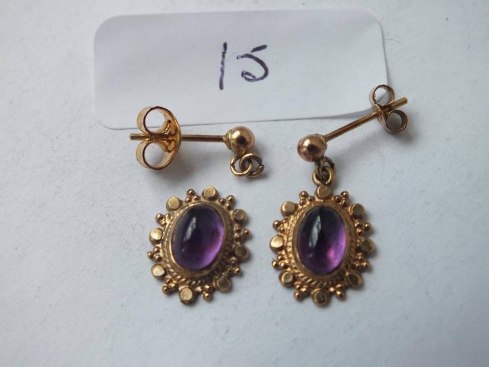 A pair of antique cabochon amethyst & gold mounted ear pendants