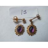 A pair of antique cabochon amethyst & gold mounted ear pendants