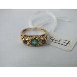 A 7 stone emerald & diamond ring set in 18ct gold - size I - 3.4gms