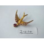 A ATTRACTIVE DIAMOND & RUBY SWALLOW BROOCH SET IN GOLD