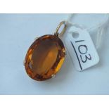 A large yellow stone oval pendant set in 9ct - 10.5gms