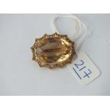 A oval citrine stone brooch in 9ct - 7.5gms
