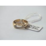 A 9ct ring with the NIKE logo set with diamonds - size K - 3.05gms