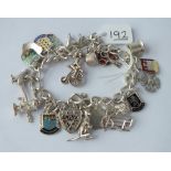 A silver charm bracelet - 53gms