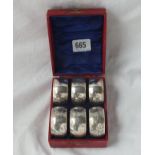 Boxed set of six silver mounted napkin rings - B'ham 1906 - fitted case