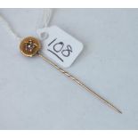 A pearl & diamond topped stick pin in 15ct gold