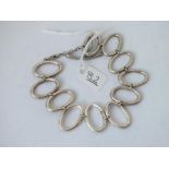 A silver oval link bracelet