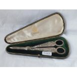 Good pair of Elkington silver grape scissors decorated with figures - B'ham 1899 - 135gms. In fitted