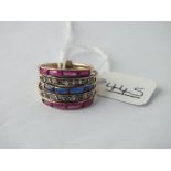 A Russian style 5 rings stone set ring - 4.5gms