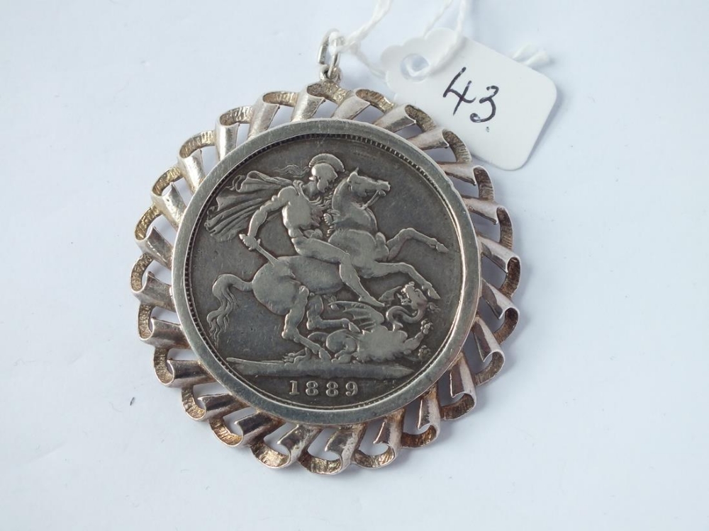 An 1889 silver Victorian crown pendant