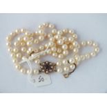 A good pearl necklace with 9ct gem set clasp