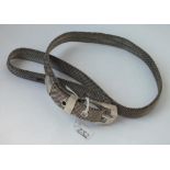 An unusual silver plated belt with clasp