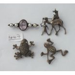 Four silver brooches