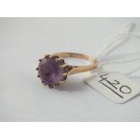 A circular purple stone dress ring set 9ct - size N - 3gms