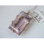 A large oblong gold mounted purple stone pendant - 16.6gms