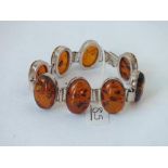 A silver & amber 8 oval panel bracelet