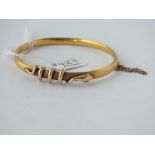 A bangle entwined with a snake in 15ct gold - 7.8gms
