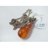 A silver & amber drop pendant necklace