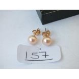 A pair of pearl ear studs in 9ct