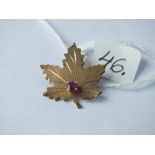 A ruby mounted leaf brooch set in gold - 1.8gms