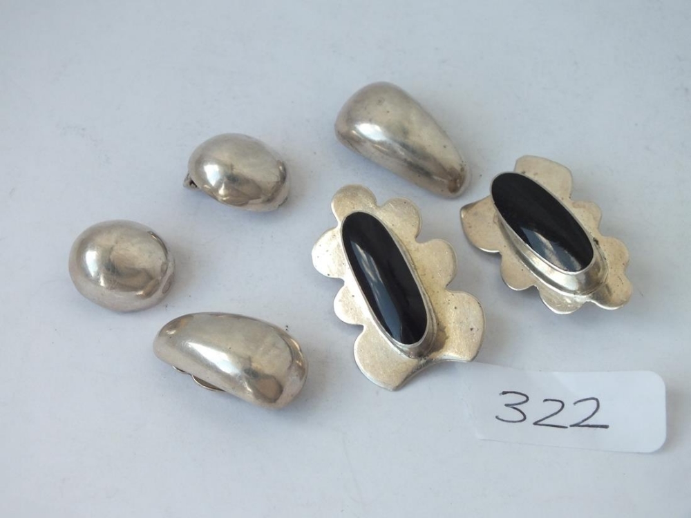 Three pairs of silver clip on earrings