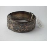 A wide silver bangle