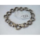 A silver circular link bracelet