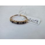A seven stone half hoop dress ring in 9ct - size P