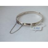 A hallmarked silver faceted bangle