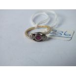 An Edwardian ruby & diamond 3 stone ring set in 18ct gold - size N - 2.7gms