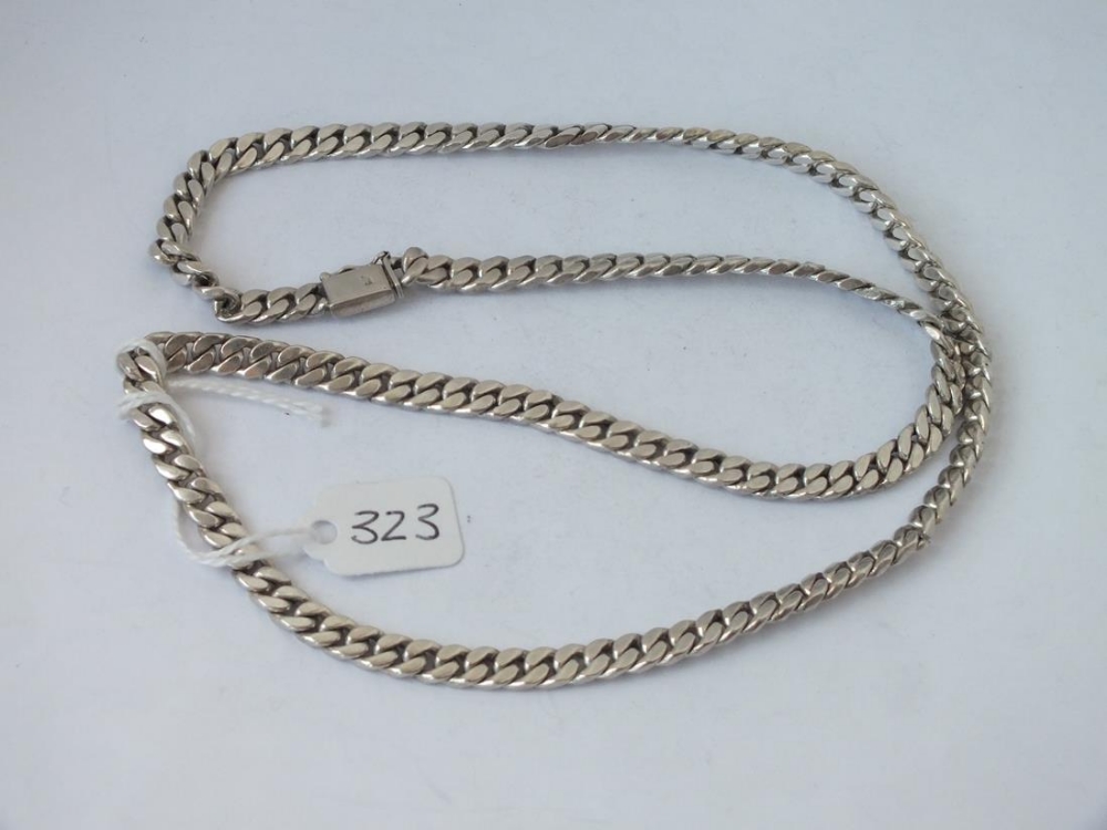 A long heavy flat link silver necklace